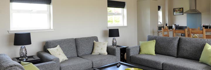 The lounge area of the main living space of the beautifully presented Castle Cottage accommodation at Castle Stuart Golf Links.