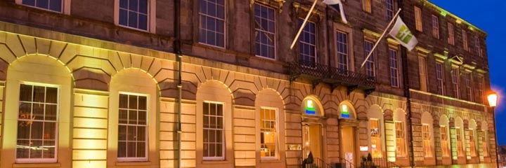 The entrance of the Holiday Inn Express Edinburgh City Centre at night