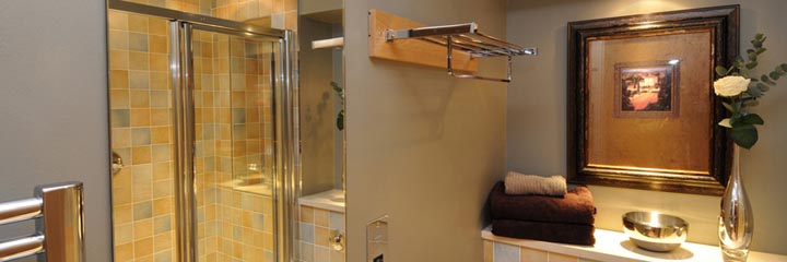 A bathroom with shower at the Highland Apartments in Inverness