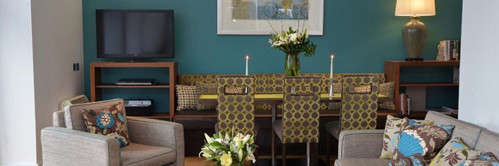 The lounge and dining area of one of the Highland Apartments