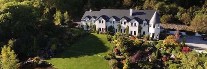 An exterior view of Loch Ness Lodge guest house and gardens