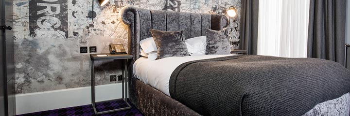 A bedroom at the Malmaison Glasgow Hotel