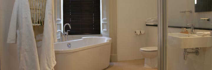 The bathroom in the master Number One bedroom at the Nether Abbey Hotel