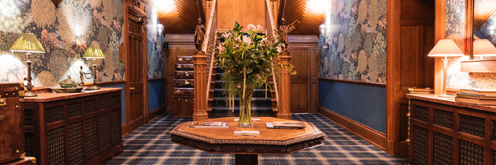 The elegant lobby of the Schloss Roxburghe Hotel in the Scottish Borders, which reflects the heritage of this Jacobean mansion, including some original features.