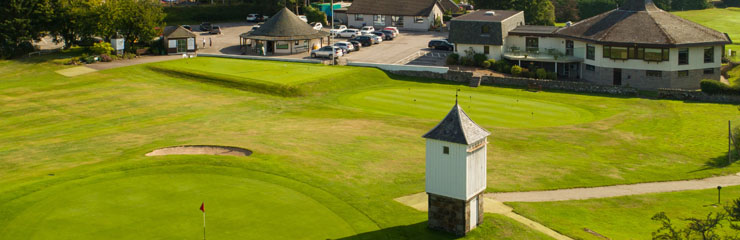 The 18th green and 1st hole at Banchory Golf Club with the clubbhouse and Professional Shop in the background