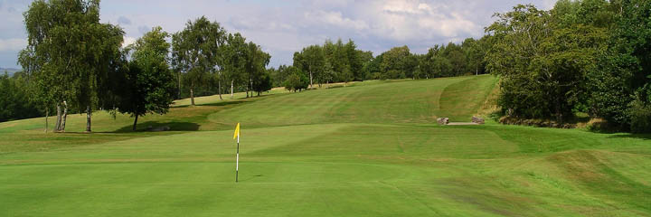 Looking down the 3rd hole at Cochrane Castle Golf Club from the green