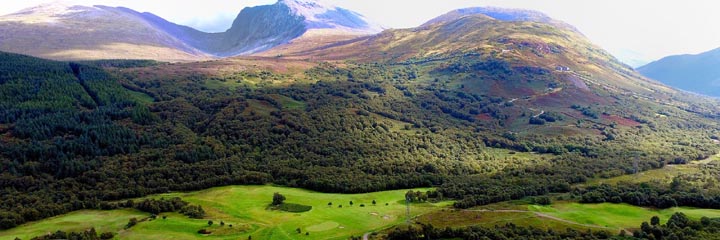 A view across Fort William golf course to the Grampian mountains