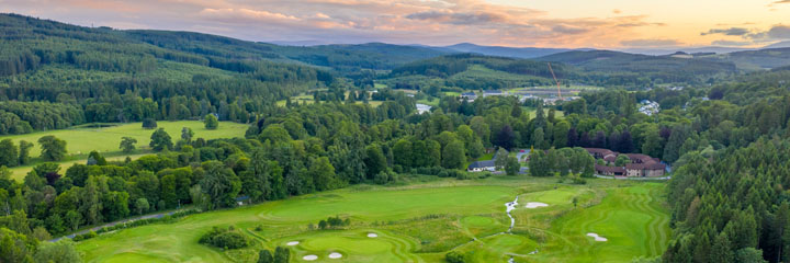 A view over the Queen's course at Inchmarlo Golf Resort to the hills beyond