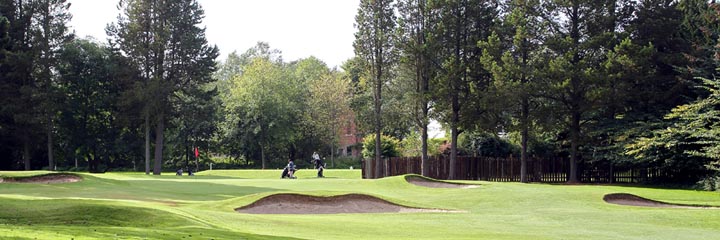 The 13th green of the parkland Inverness golf course