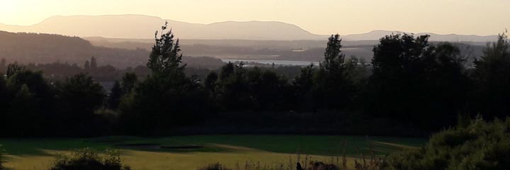 The 10th green of the New course at Loch Ness Golf Club looking towards Ben Wyvis