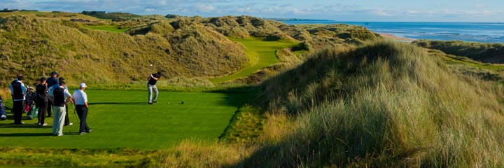 Tee-ing off on the 6th hole at the Trump International Golf Links in Aberdeenshire, with the North Sea in the background