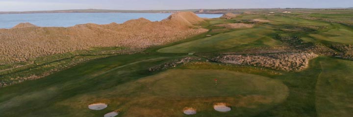 A aerial shot Wick Golf Club links in the North of Scotland, showing the towering sand dunes that lie between the golf course and the North Sea